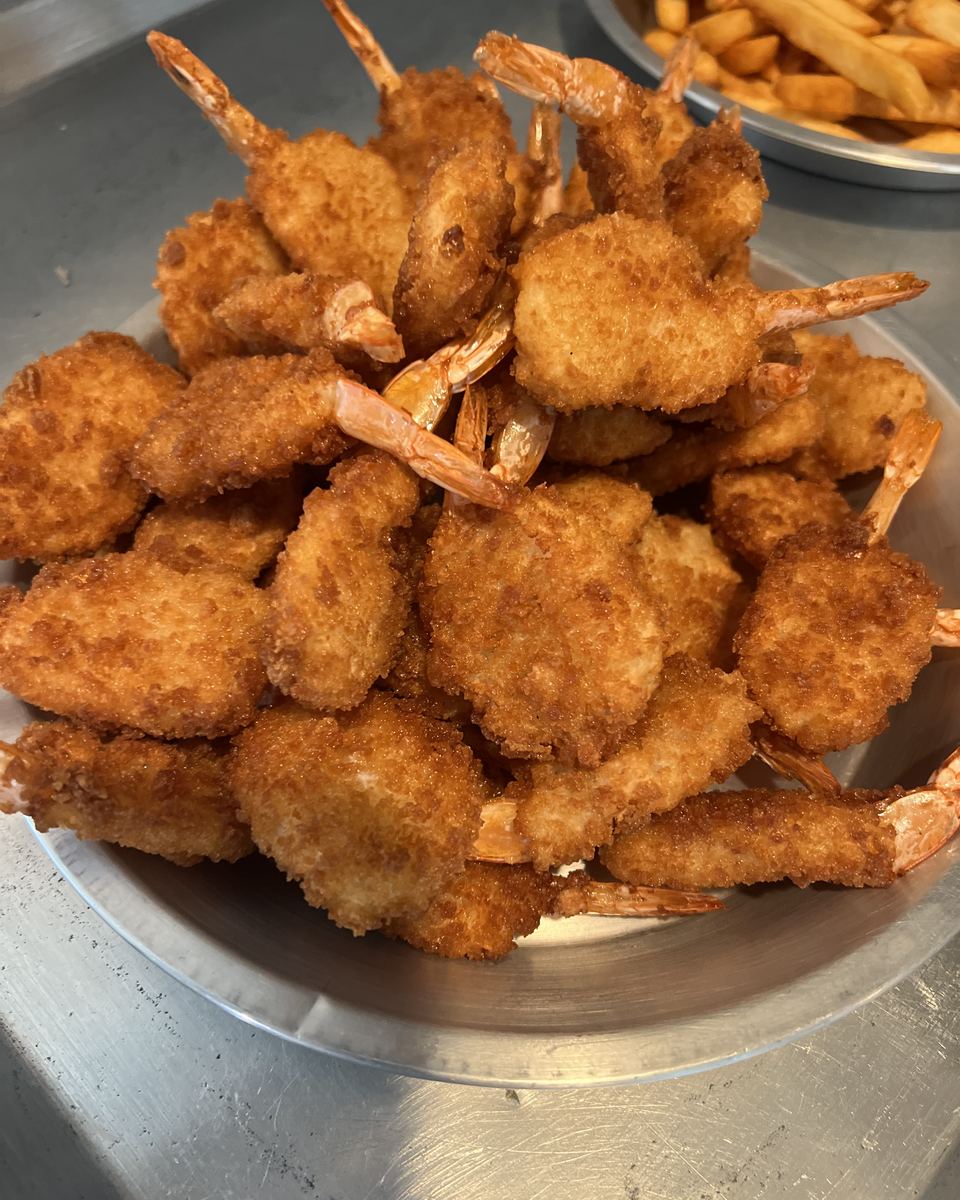 A heaping bowl of golden fried shrimp from Odie's kitchen