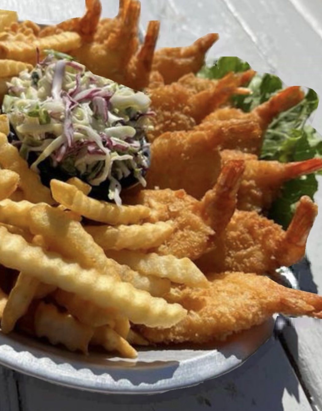 Breaded jumbo shrimp with crinkle fries and coleslaw